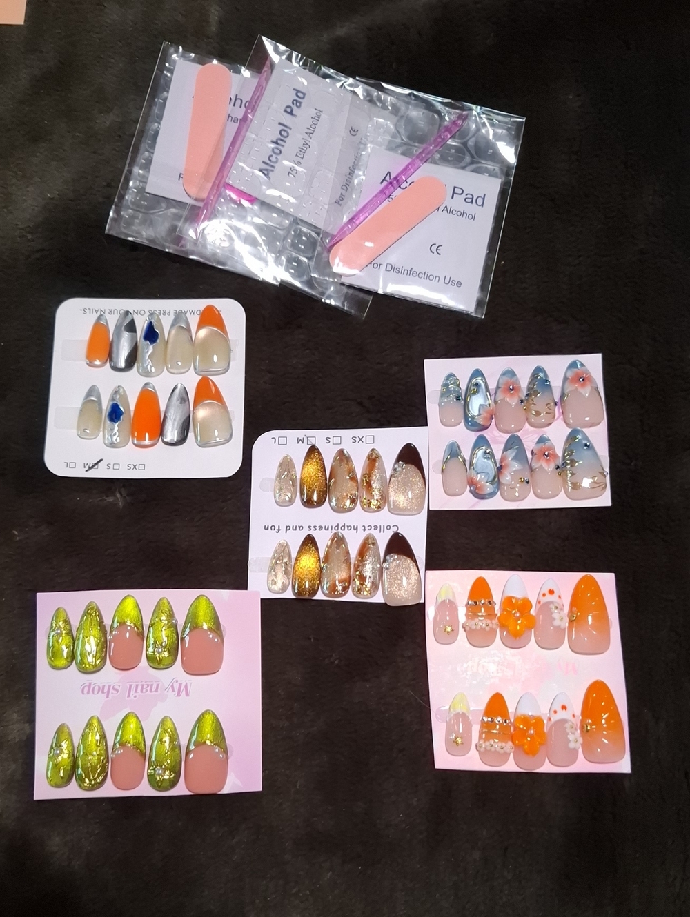 **5 SETS of PRESS ON NAILS**